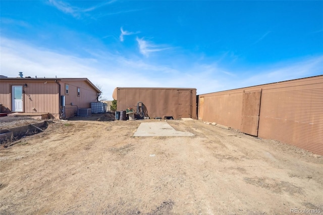 6670 Indian Village Hts, Fountain, CO 80817 - view of yard with central air condition unit and an outbuilding