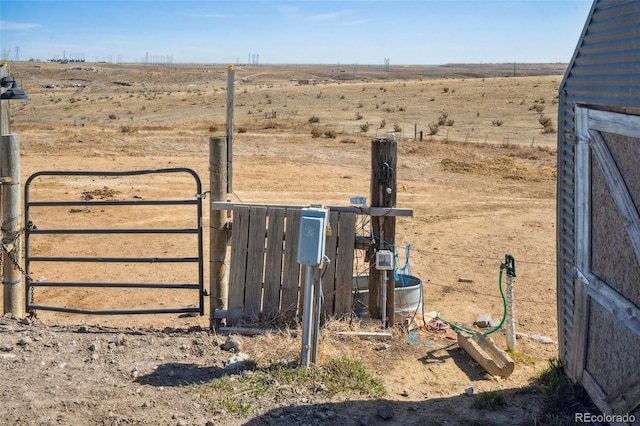 6670 Indian Village Hts, Fountain, CO 80817 - view of yard featuring a gate, a rural view, and fence