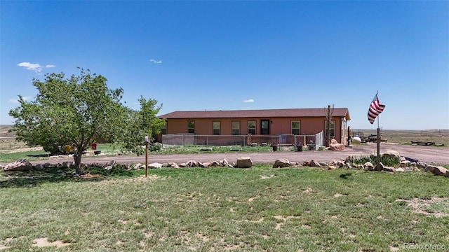 6670 Indian Village Hts, Fountain, CO 80817 - rear view of property with a yard