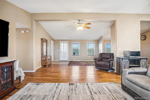 6670 Indian Village Hts, Fountain, CO 80817 - living area featuring ceiling fan, wood finished floors, baseboards, and vaulted ceiling