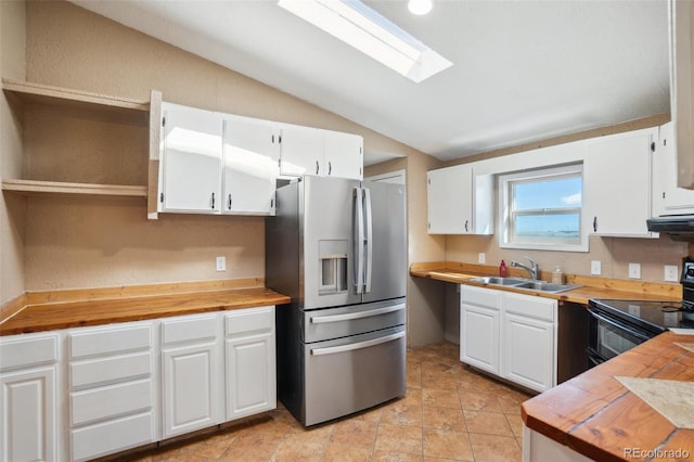 6670 Indian Village Hts, Fountain, CO 80817 - kitchen with stainless steel fridge with ice dispenser, a sink, butcher block counters, lofted ceiling, and black / electric stove