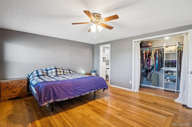6670 Indian Village Hts, Fountain, CO 80817 - bedroom with wood finished floors, connected bathroom, baseboards, and a ceiling fan
