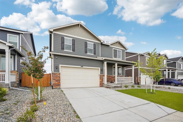 715 N Amory St, Watkins, CO 80137 - craftsman inspired home with a porch, driveway, an attached garage, and stone siding