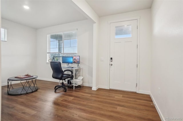 715 N Amory St, Watkins, CO 80137 - entrance foyer with plenty of natural light, wood finished floors, and baseboards