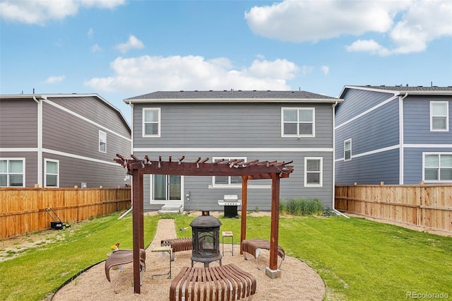 715 N Amory St, Watkins, CO 80137 - back of property featuring a pergola, a fire pit, and a patio area