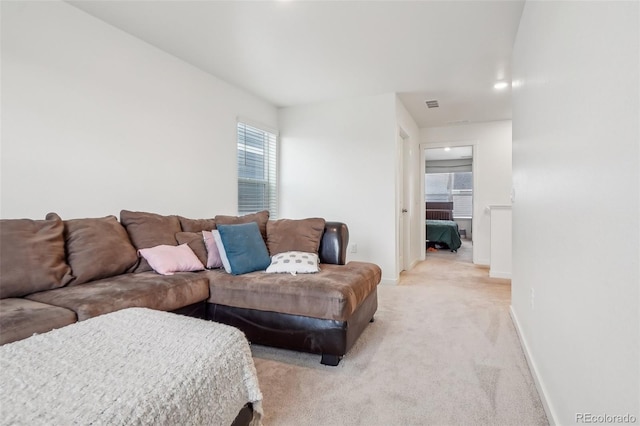 715 N Amory St, Watkins, CO 80137 - living room with light carpet and baseboards