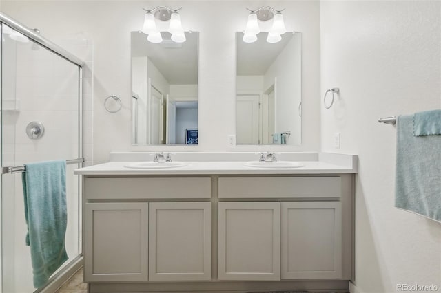 715 N Amory St, Watkins, CO 80137 - full bathroom featuring double vanity and a tile shower