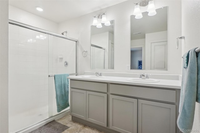 715 N Amory St, Watkins, CO 80137 - full bathroom featuring a stall shower and double vanity