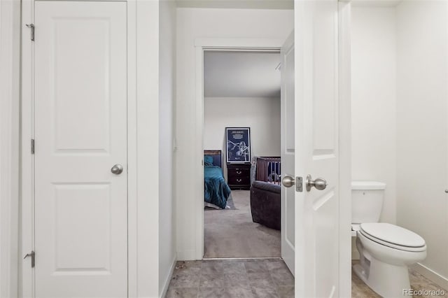 715 N Amory St, Watkins, CO 80137 - bathroom with baseboards and toilet