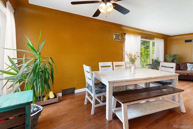 dining area featuring ceiling fan and hardwood / wood-style floors