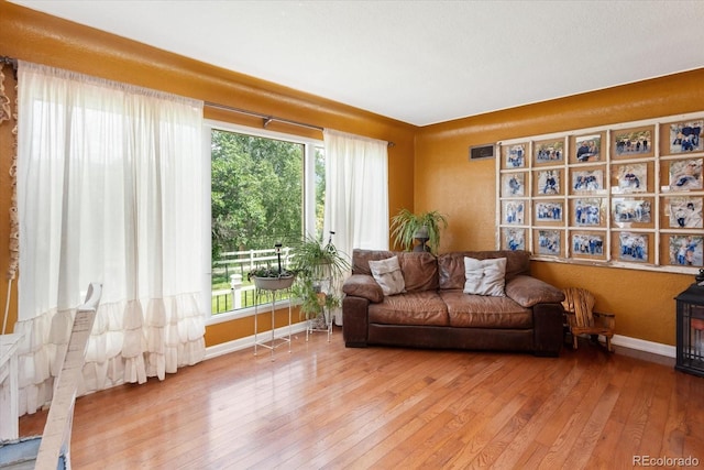 sitting room with hardwood / wood-style floors