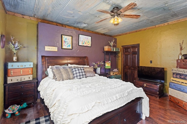 bedroom featuring ceiling fan, dark hardwood / wood-style flooring, and wood ceiling