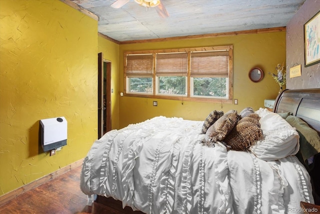 bedroom with heating unit, ceiling fan, crown molding, and wood ceiling