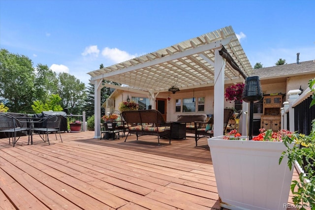 wooden terrace with a pergola, an outdoor hangout area, and ceiling fan