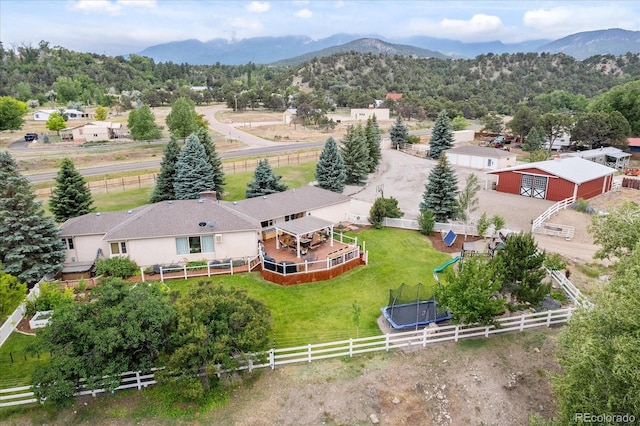 drone / aerial view with a mountain view and a rural view