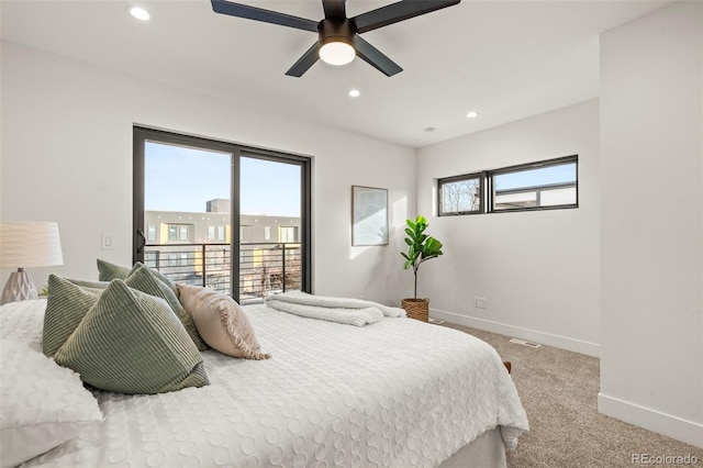 carpeted bedroom featuring multiple windows, access to outside, and ceiling fan