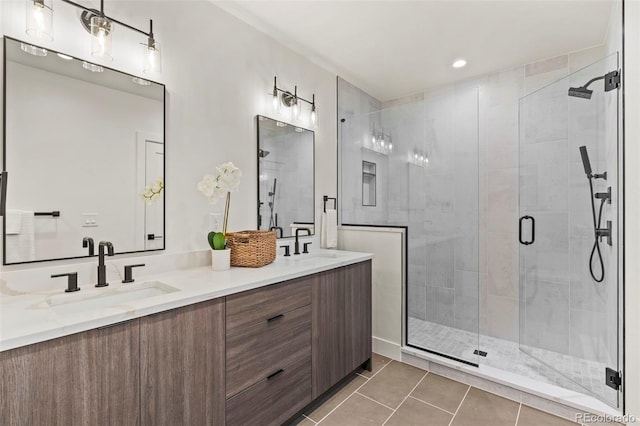 bathroom featuring vanity, tile patterned floors, and a shower with shower door