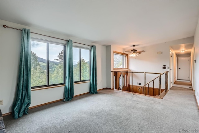 30839 Manitoba Dr, Evergreen, CO 80439 - carpeted spare room with baseboards and a ceiling fan