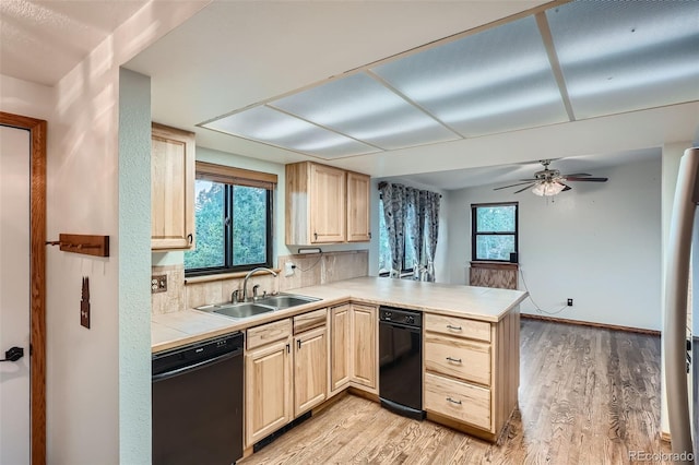 30839 Manitoba Dr, Evergreen, CO 80439 - kitchen featuring dishwasher, light brown cabinetry, a peninsula, and tile counters