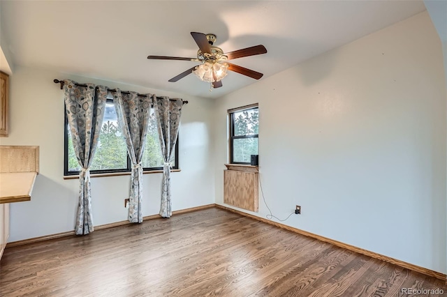 30839 Manitoba Dr, Evergreen, CO 80439 - unfurnished room with wood finished floors and a ceiling fan