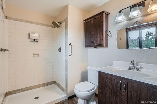 30839 Manitoba Dr, Evergreen, CO 80439 - full bathroom featuring tiled shower and vanity