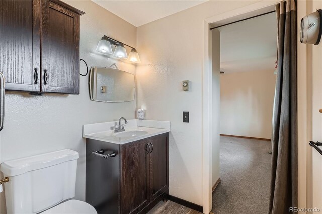 30839 Manitoba Dr, Evergreen, CO 80439 - half bathroom with toilet and vanity