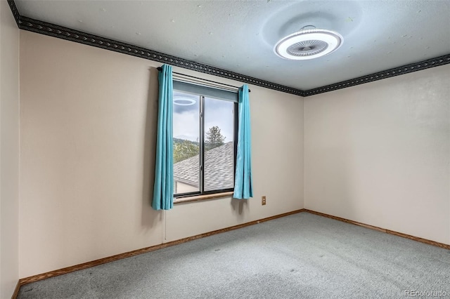 30839 Manitoba Dr, Evergreen, CO 80439 - carpeted spare room with baseboards and crown molding