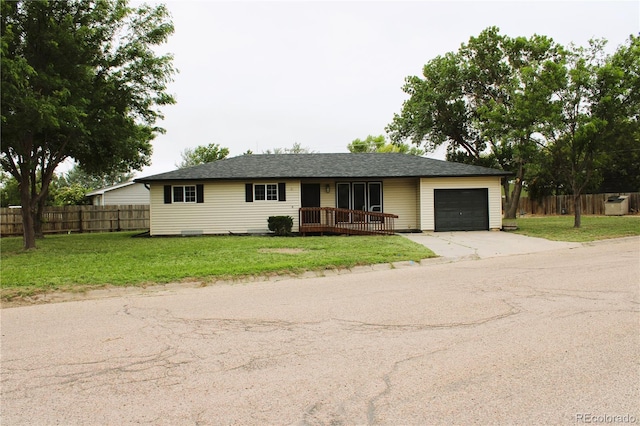 single story home with a front yard and a garage