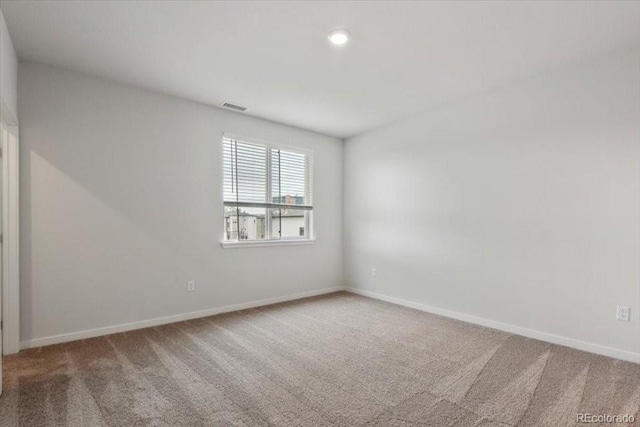 unfurnished room featuring carpet floors