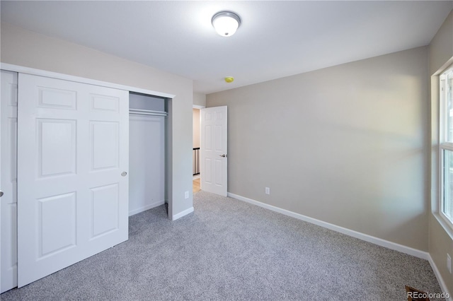 8713 E Roundtree Ave, Greenwood Village, CO 80111 - unfurnished bedroom featuring carpet floors and a closet