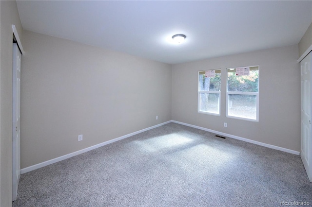 8713 E Roundtree Ave, Greenwood Village, CO 80111 - unfurnished bedroom with carpet floors and baseboards