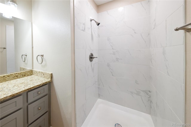 8713 E Roundtree Ave, Greenwood Village, CO 80111 - bathroom with vanity and tiled shower