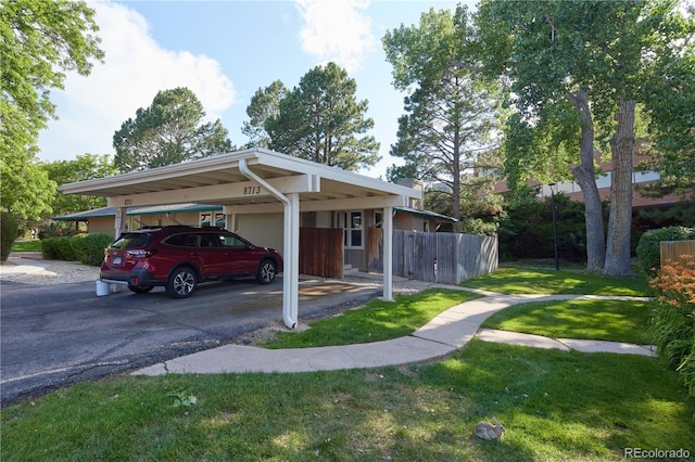 8713 E Roundtree Ave, Greenwood Village, CO 80111 - view of parking with a carport and driveway