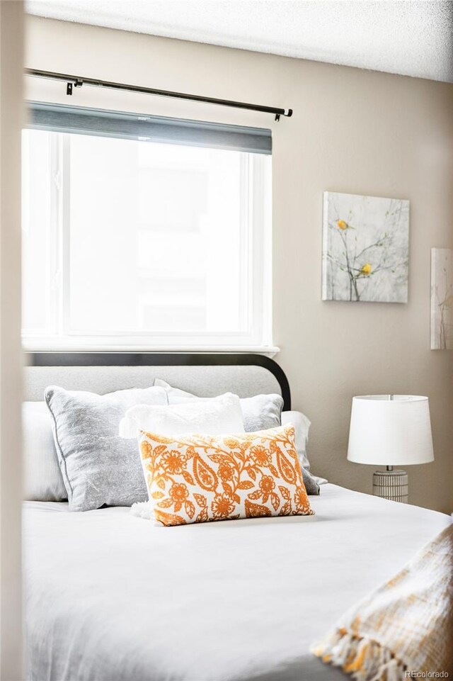 bedroom featuring multiple windows