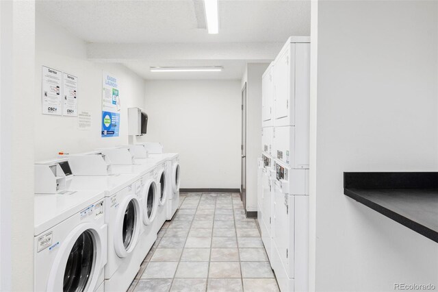 shared laundry room featuring stacked washer / drying machine and washing machine and clothes dryer