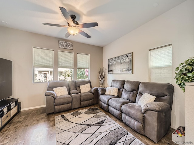 living room featuring ceiling fan and hardwood / wood-style flooring