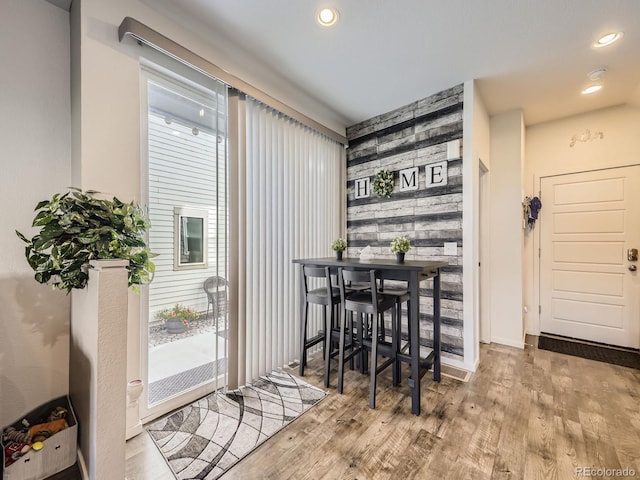 dining room featuring a wealth of natural light and light wood-type flooring