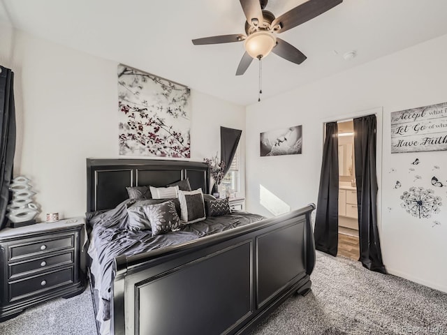 bedroom featuring carpet, ceiling fan, and ensuite bathroom