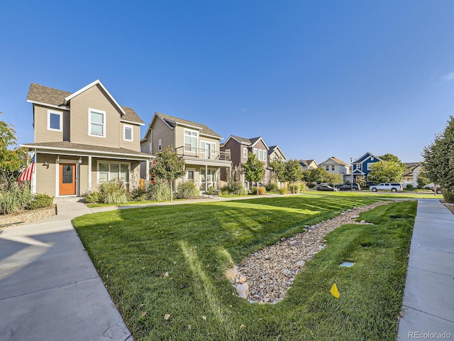 view of front of property featuring a front yard and a porch