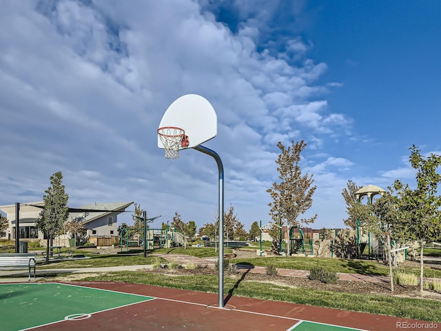 view of sport court featuring a playground