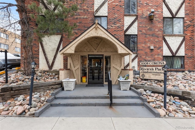 entrance to property with brick siding