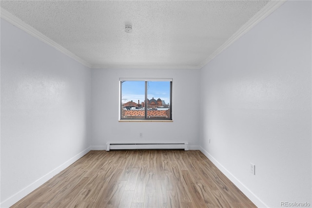 unfurnished room with wood finished floors, baseboards, a textured ceiling, crown molding, and baseboard heating