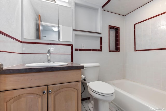 bathroom with backsplash, toilet, vanity, tile patterned floors, and tile walls