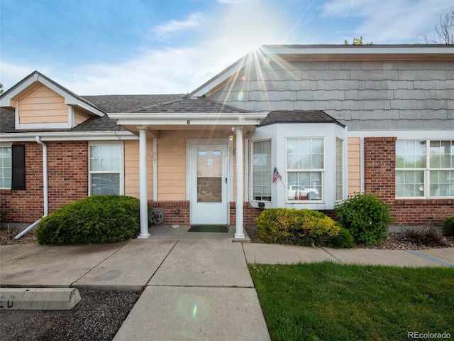 1748 Eagle St Unit B, Aurora, CO 80011 - view of front of house with roof with shingles and brick siding