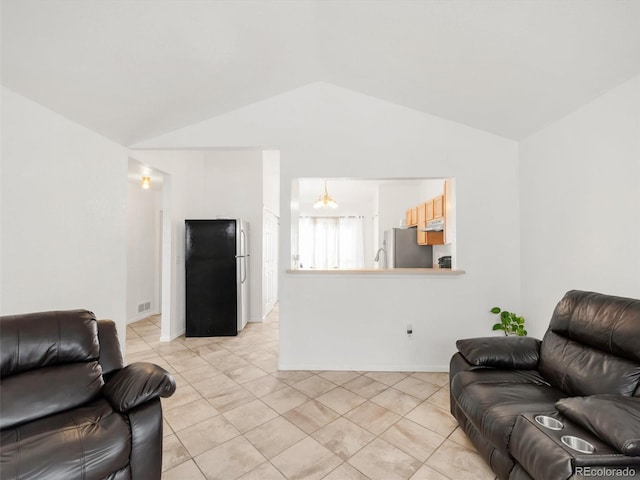 1748 Eagle St Unit B, Aurora, CO 80011 - living area featuring lofted ceiling, baseboards, light tile patterned floors, and visible vents