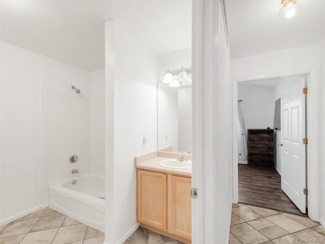 1748 Eagle St Unit B, Aurora, CO 80011 - bathroom featuring baseboards, tile patterned floors, vanity, and shower / washtub combination