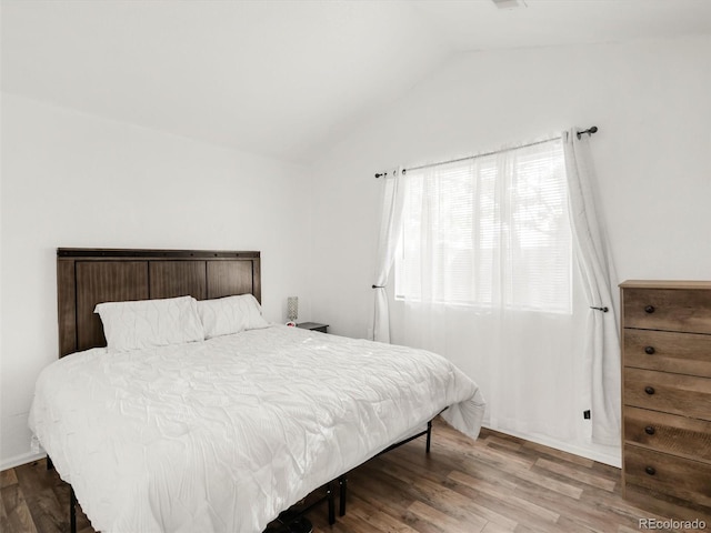 1748 Eagle St Unit B, Aurora, CO 80011 - bedroom with vaulted ceiling and wood finished floors