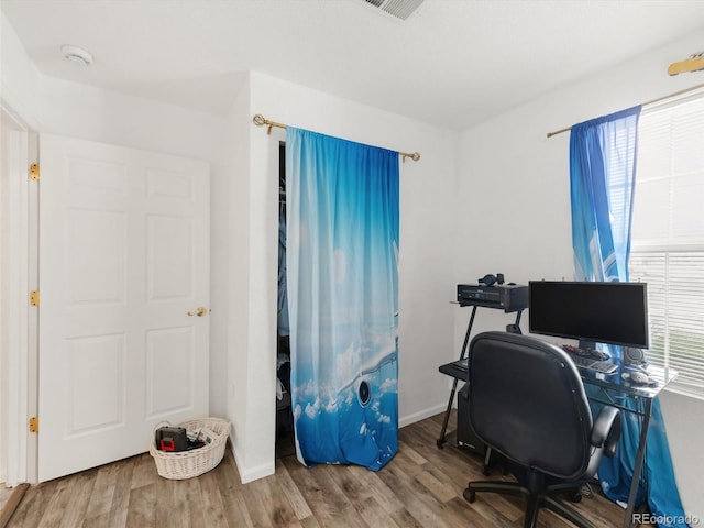 1748 Eagle St Unit B, Aurora, CO 80011 - office featuring baseboards, visible vents, and wood finished floors