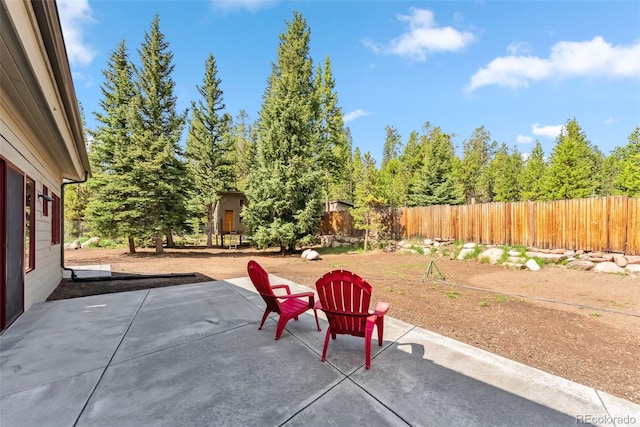 475 Vail Cir, Dillon, CO 80435 - fenced backyard with a patio area and view of wooded area