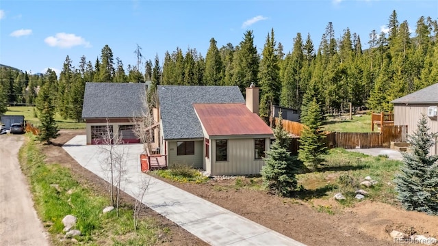 475 Vail Cir, Dillon, CO 80435 - view of front of property with concrete driveway and a chimney